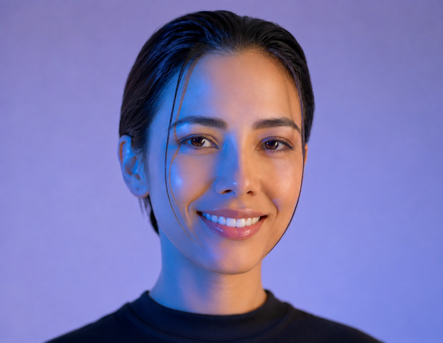 Natural Smile Design transformation showcasing facial symmetry and natural porcelain veneers